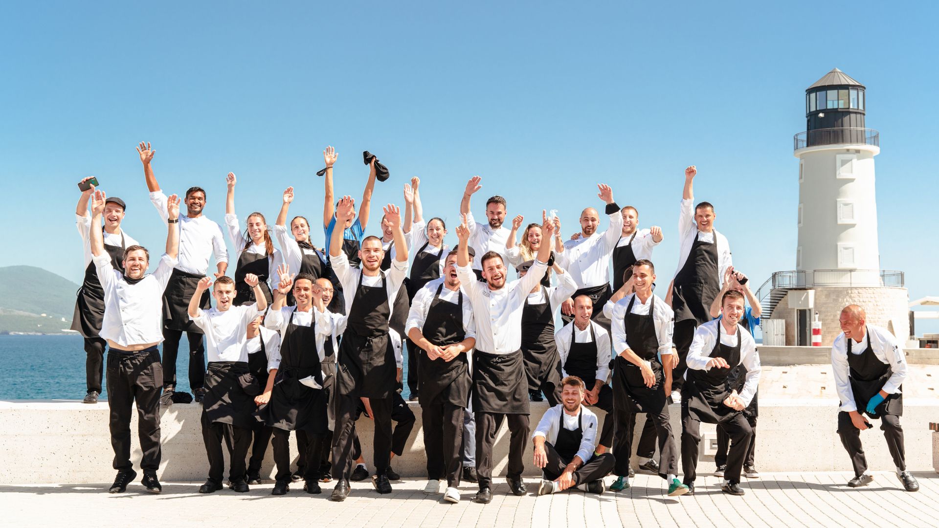 A Group of The Chedi Staff Posing For A Photo