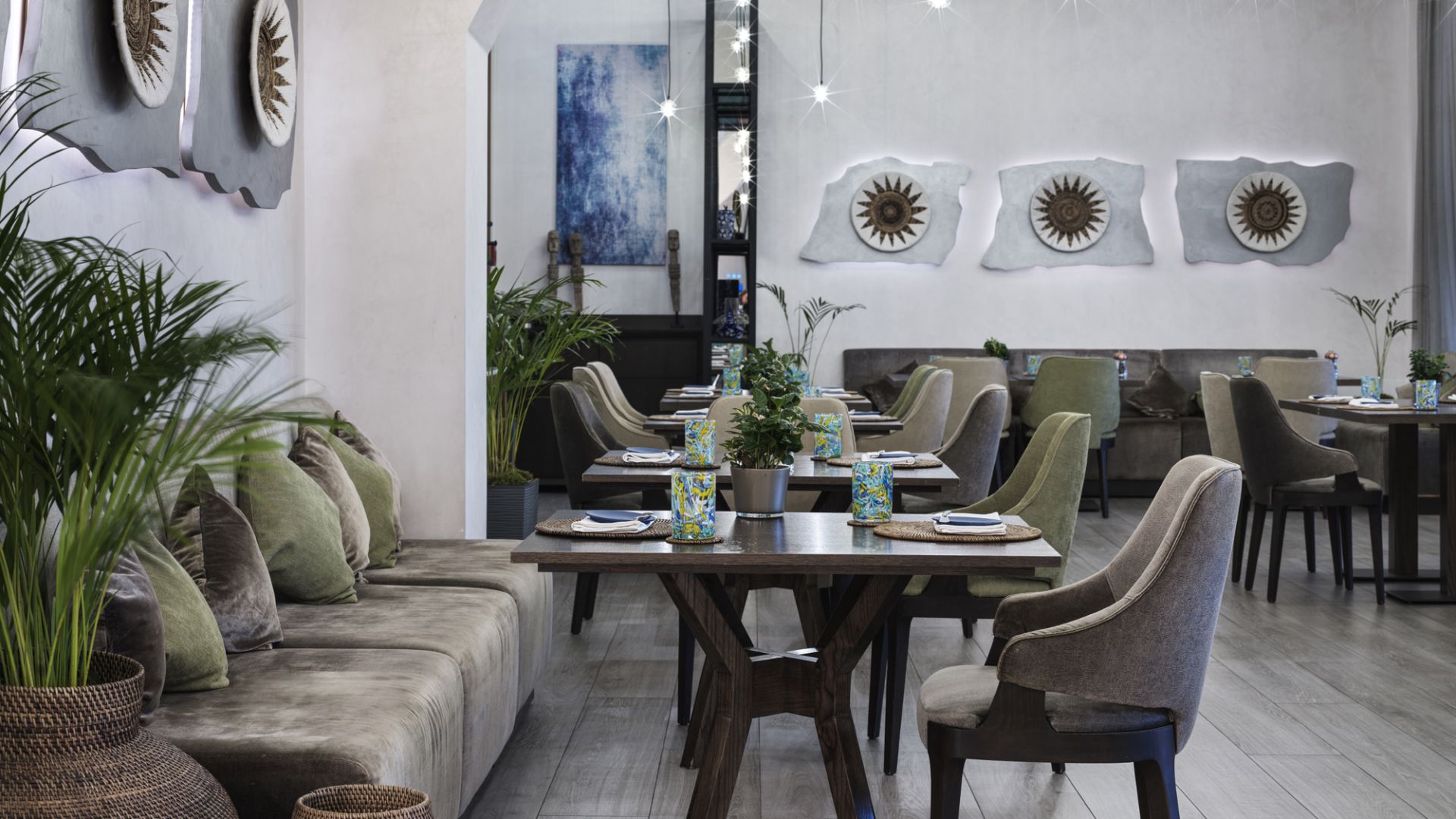 A Room With A Table Chairs And A Couch