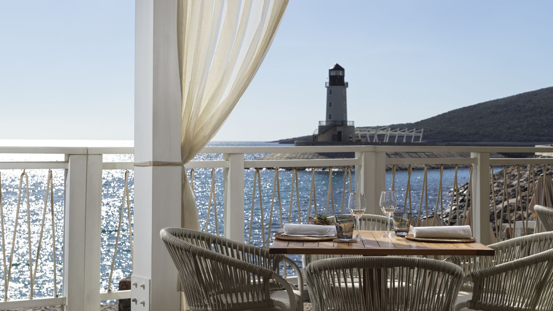 A Table And Chairs On A Balcony