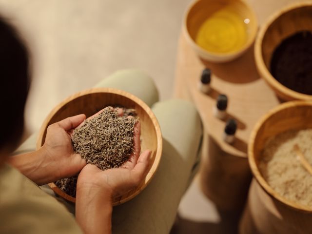 A Person Holding A Cup Of Coffee